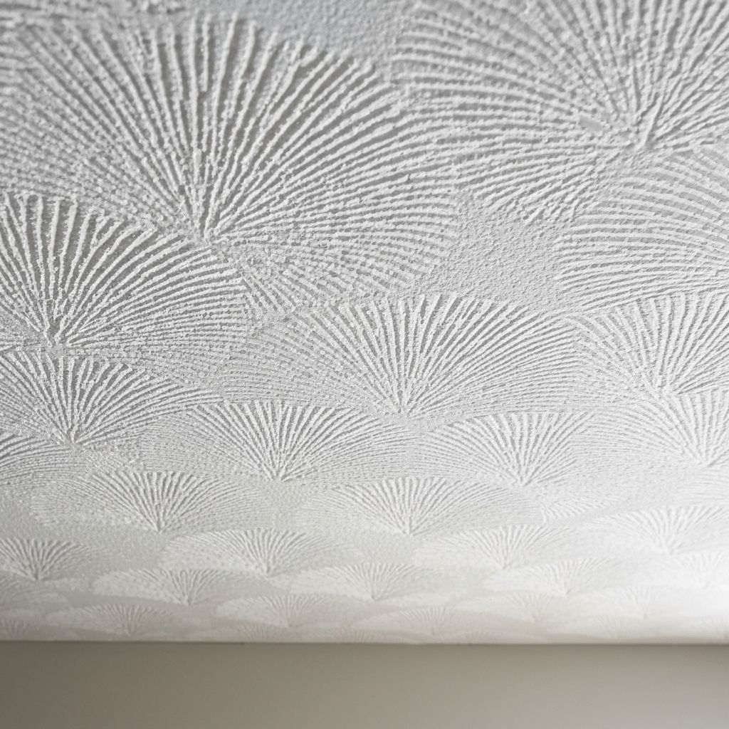 Close-up artex ceiling texture — smooth over skim finish